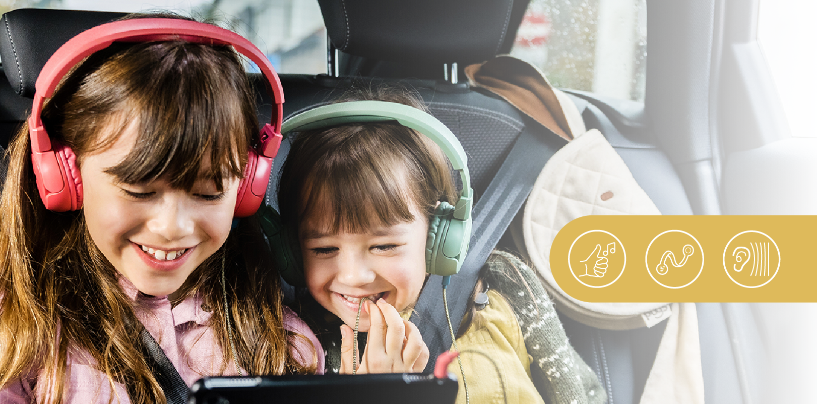 Two girls enjoying listening with The Elephant headphones 