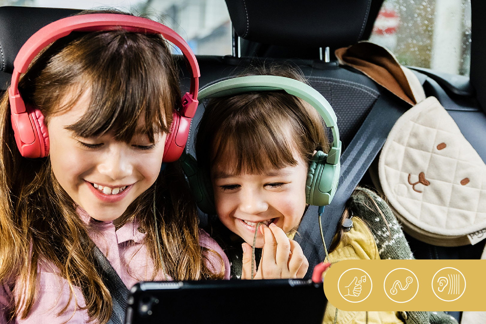 Two girls enjoying listening with The Elephant headphones
