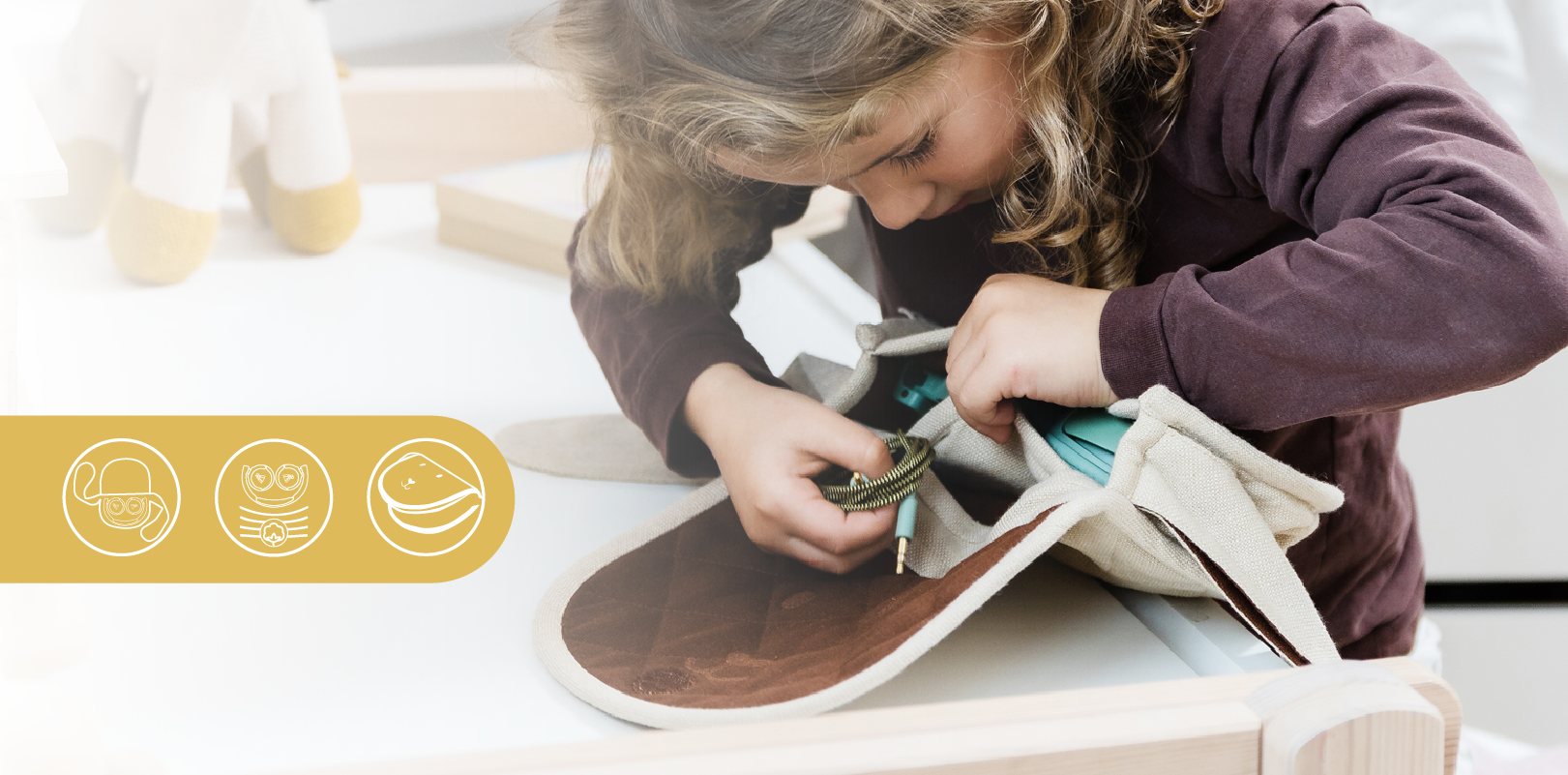 Girl putting her headphones and cables inside The Wallaby pouch