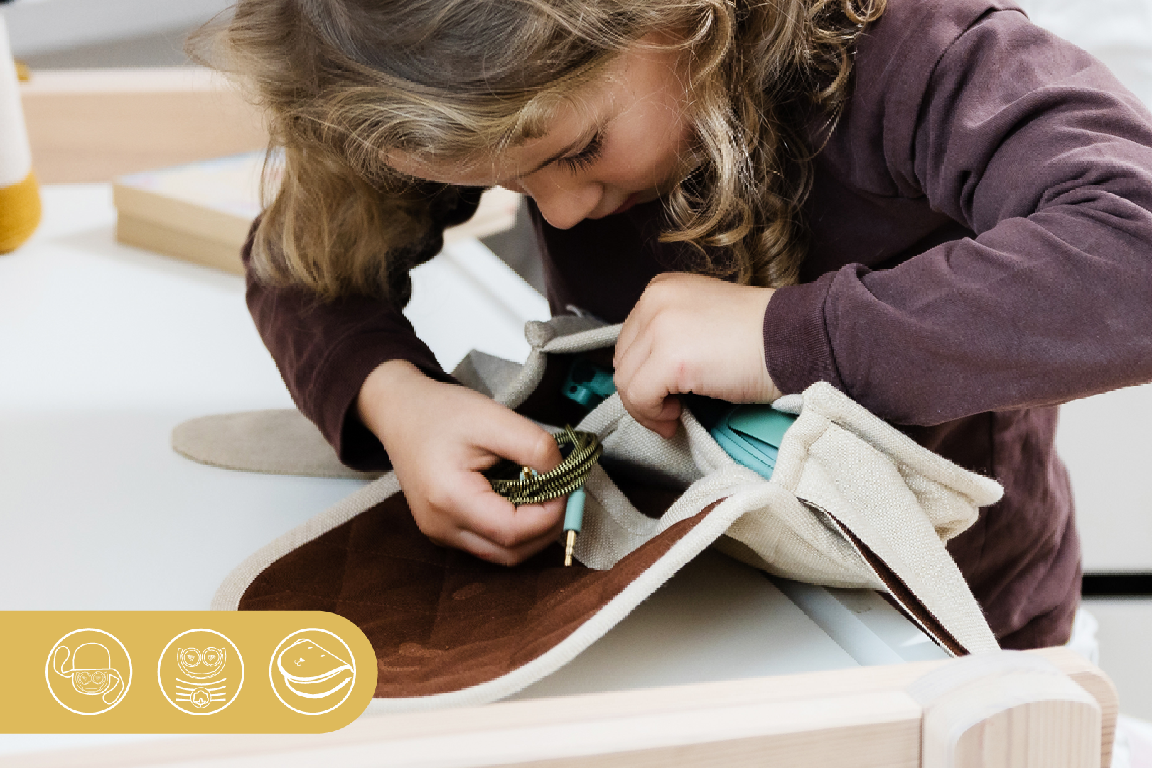Girl putting her headphones and cables inside The Wallaby pouch