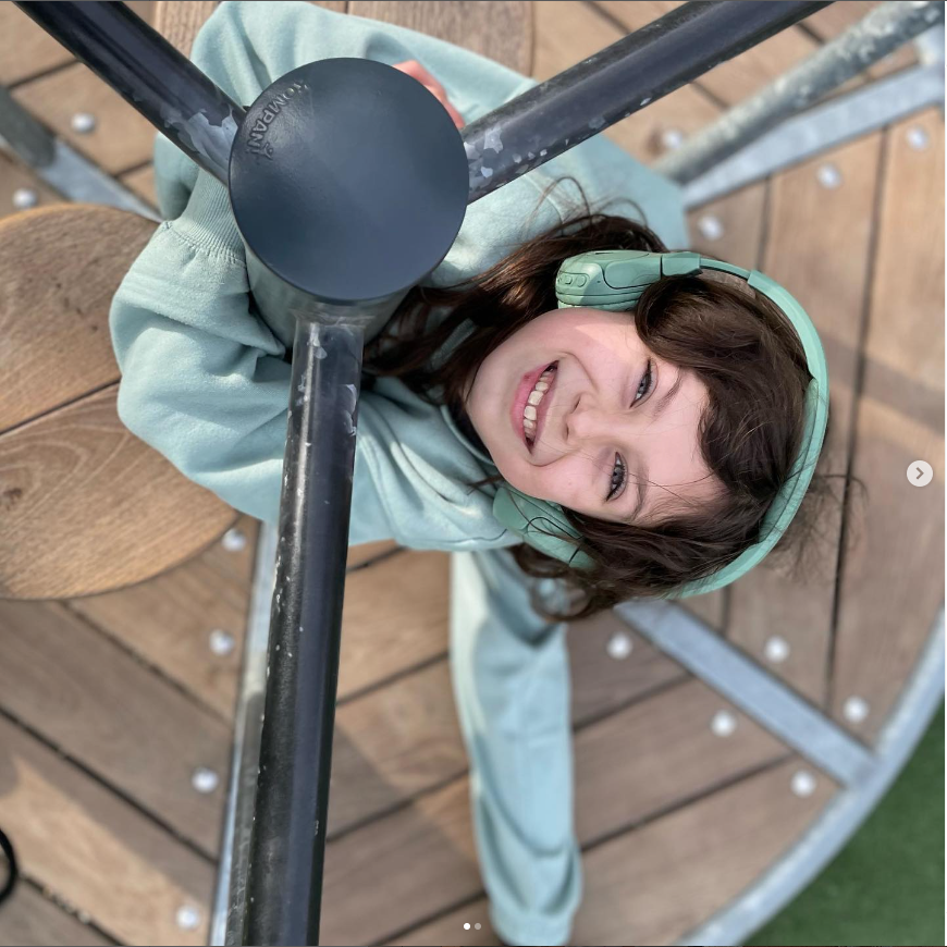 Girl in the playground with POGS