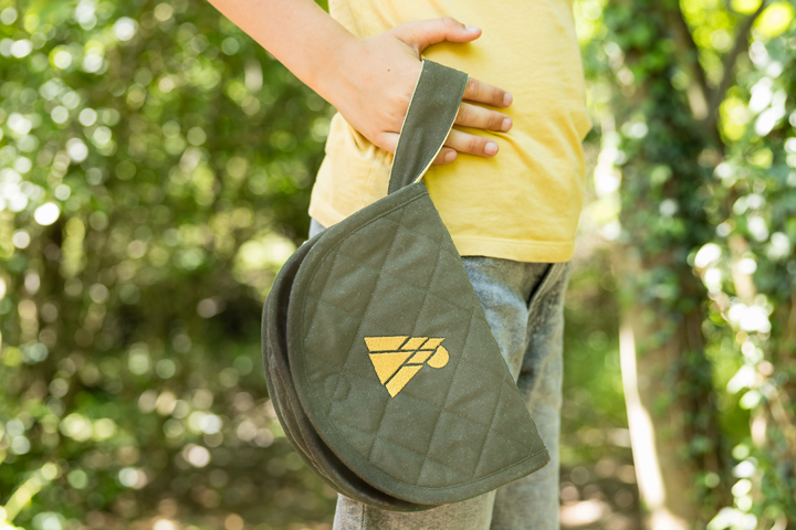 Boy carrying The Kangaroo travel pouch